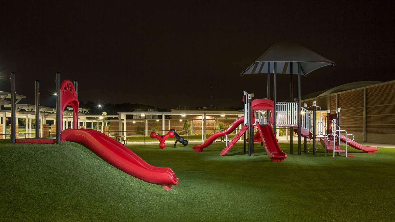 Nighttime artificial turf playground by Southwest Greens of Southern California
